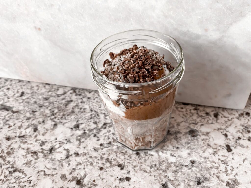 Almond Cookie Dough Oats topped with hemp seeds and cacao nibs